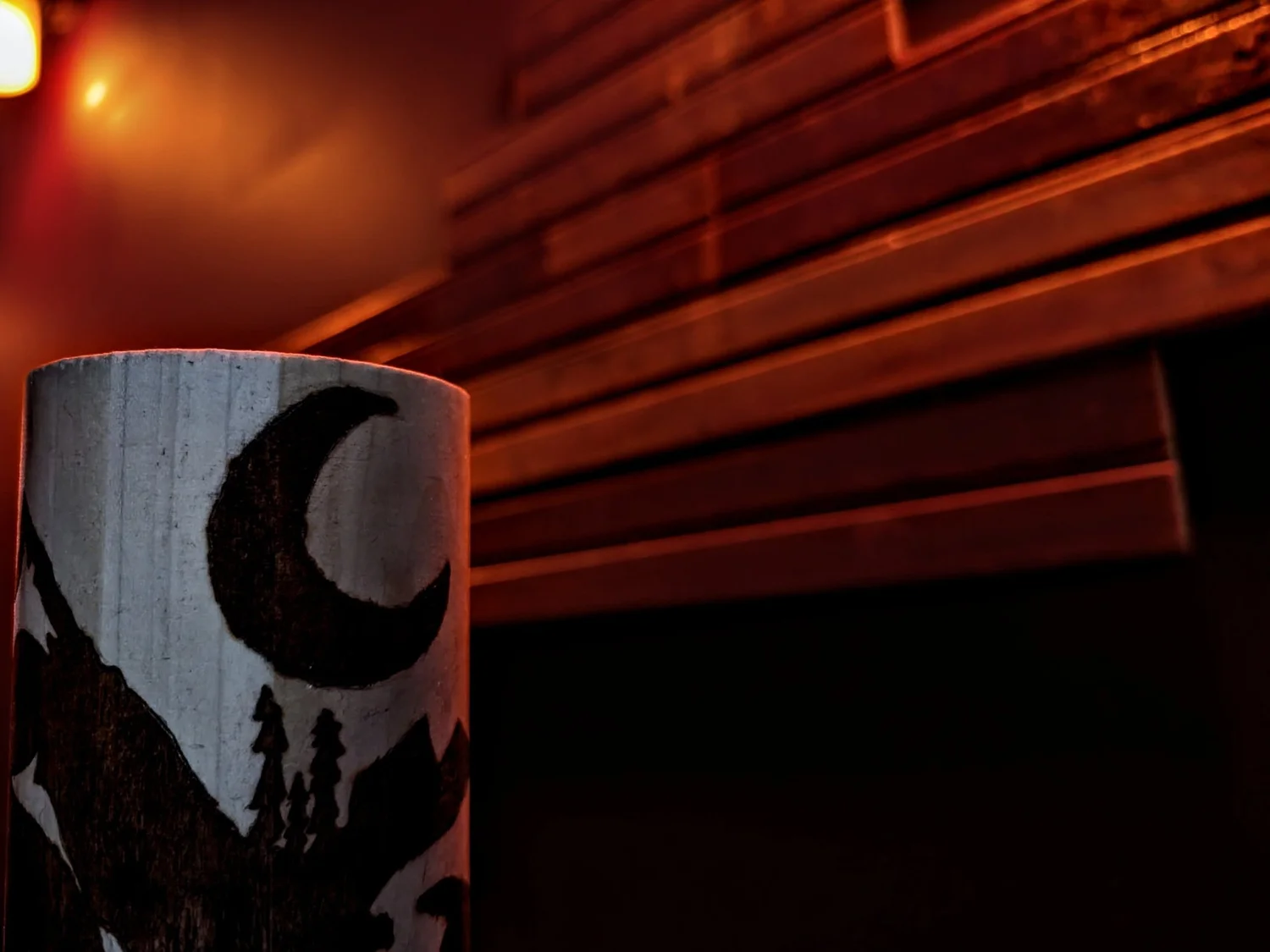 The Cryptid Cabin escape room set: a cosy backwoods cabin in a haunted forest